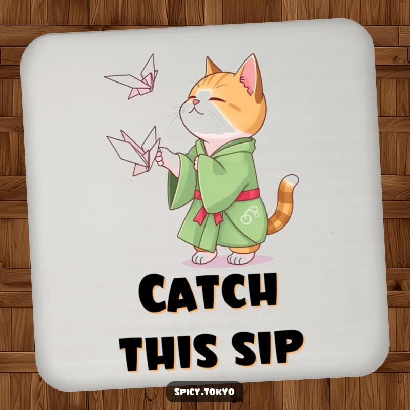 Funny cat in a green kimono playfully attempting to catch a floating origami crane, a fun drink coaster.