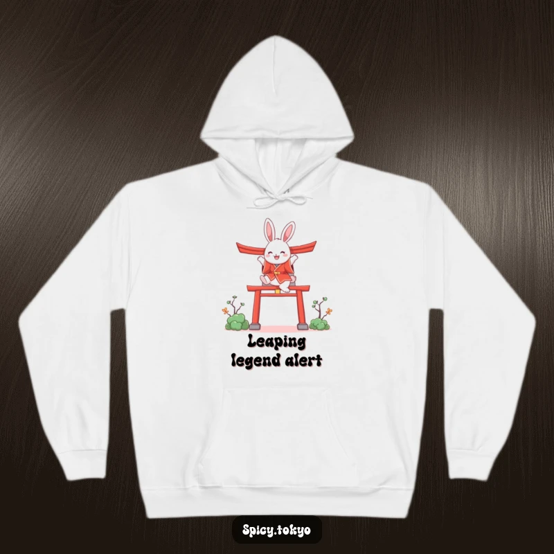 Funny fluffy bunny in a red kimono leaping over a stylized torii gate, a humorous and cozy gift.