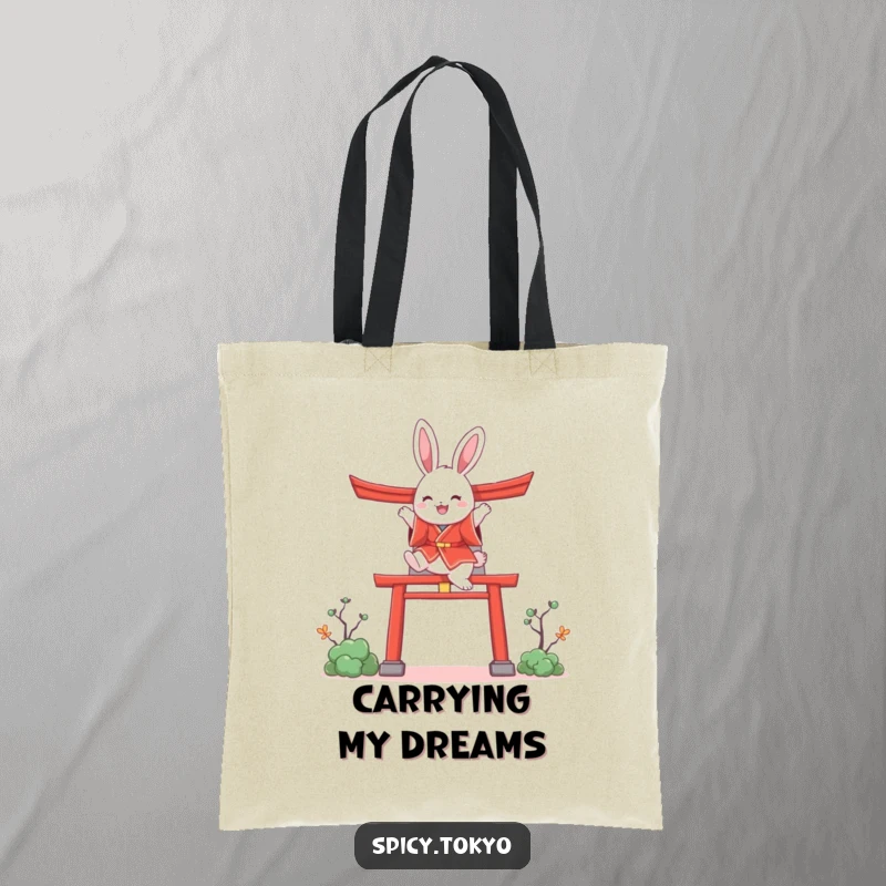 Funny bunny in a red kimono joyfully leaping over a stylized torii gate design on a tote bag.